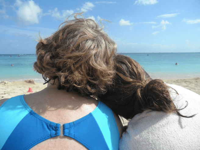 Mother daughter look at ocean